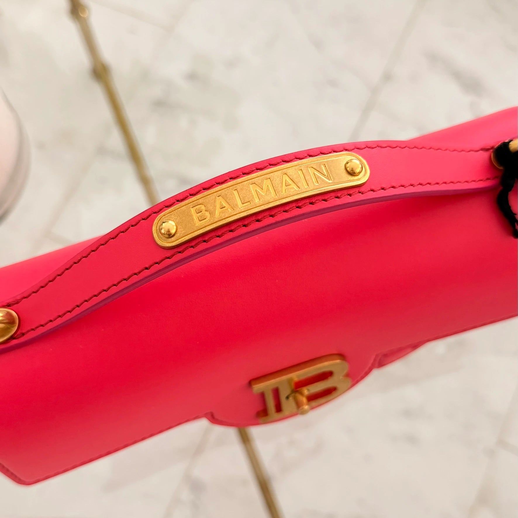 Balmain | 24 B-Buzz leather crossbody bag in Pink