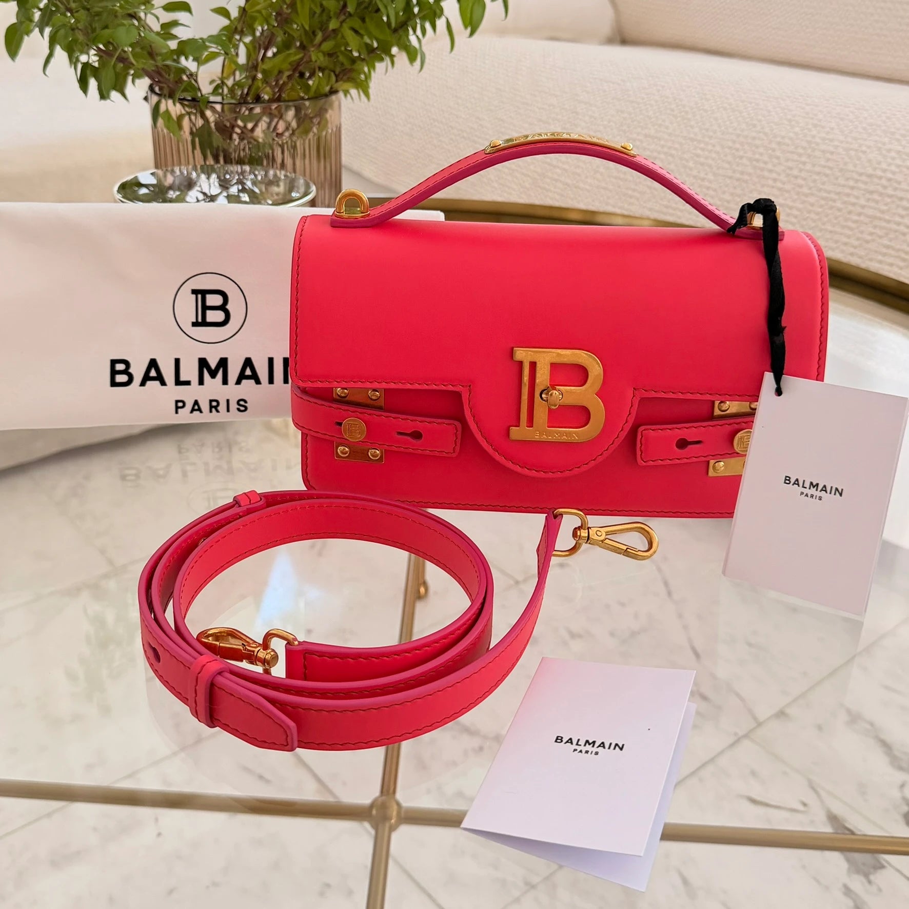 Balmain | 24 B-Buzz leather crossbody bag in Pink