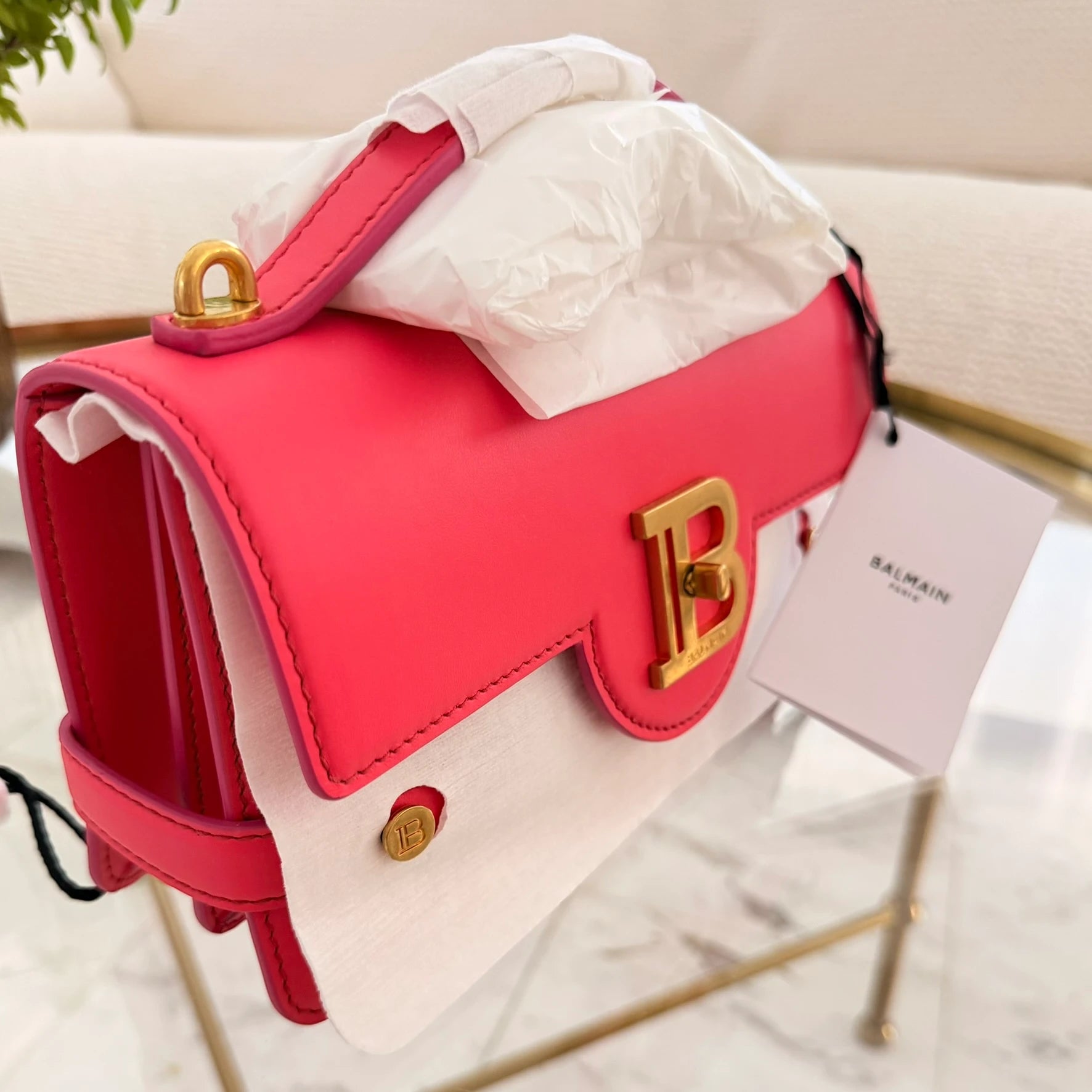 Balmain | 24 B-Buzz leather crossbody bag in Pink