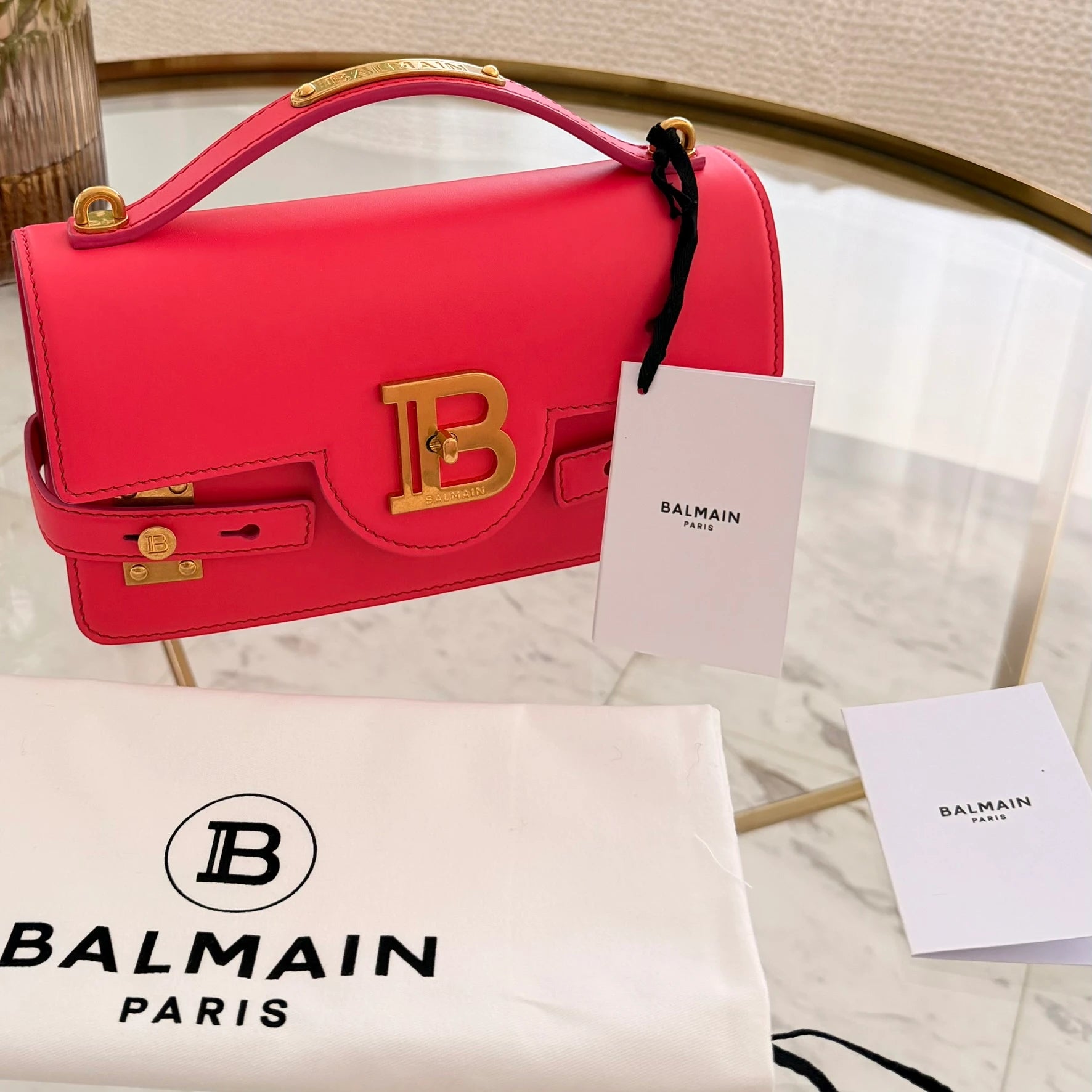 Balmain | 24 B-Buzz leather crossbody bag in Pink