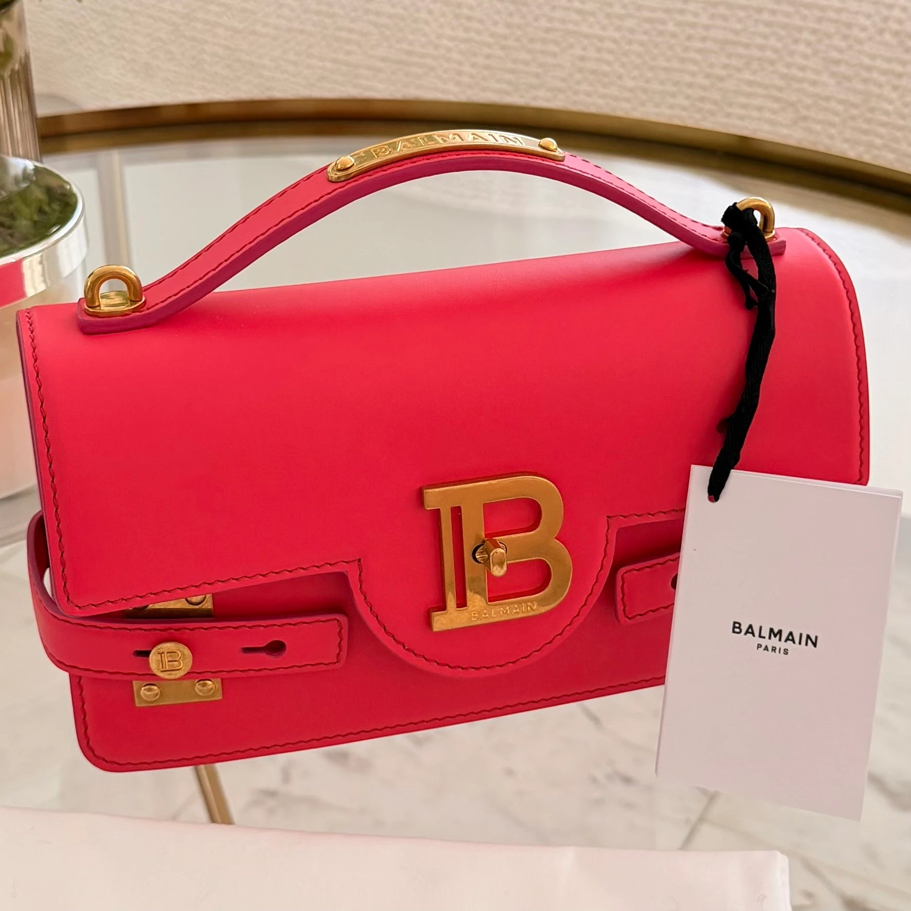 Balmain | 24 B-Buzz leather crossbody bag in Pink
