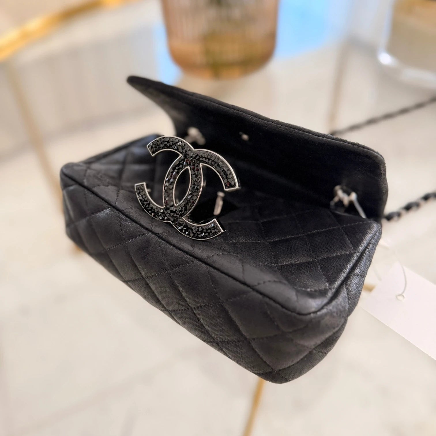 CC logo of Chanel iridescent caviar crystal CC Wallet On Chain crossbody, silver hardware available in Cyprus at HOUSE of MICY