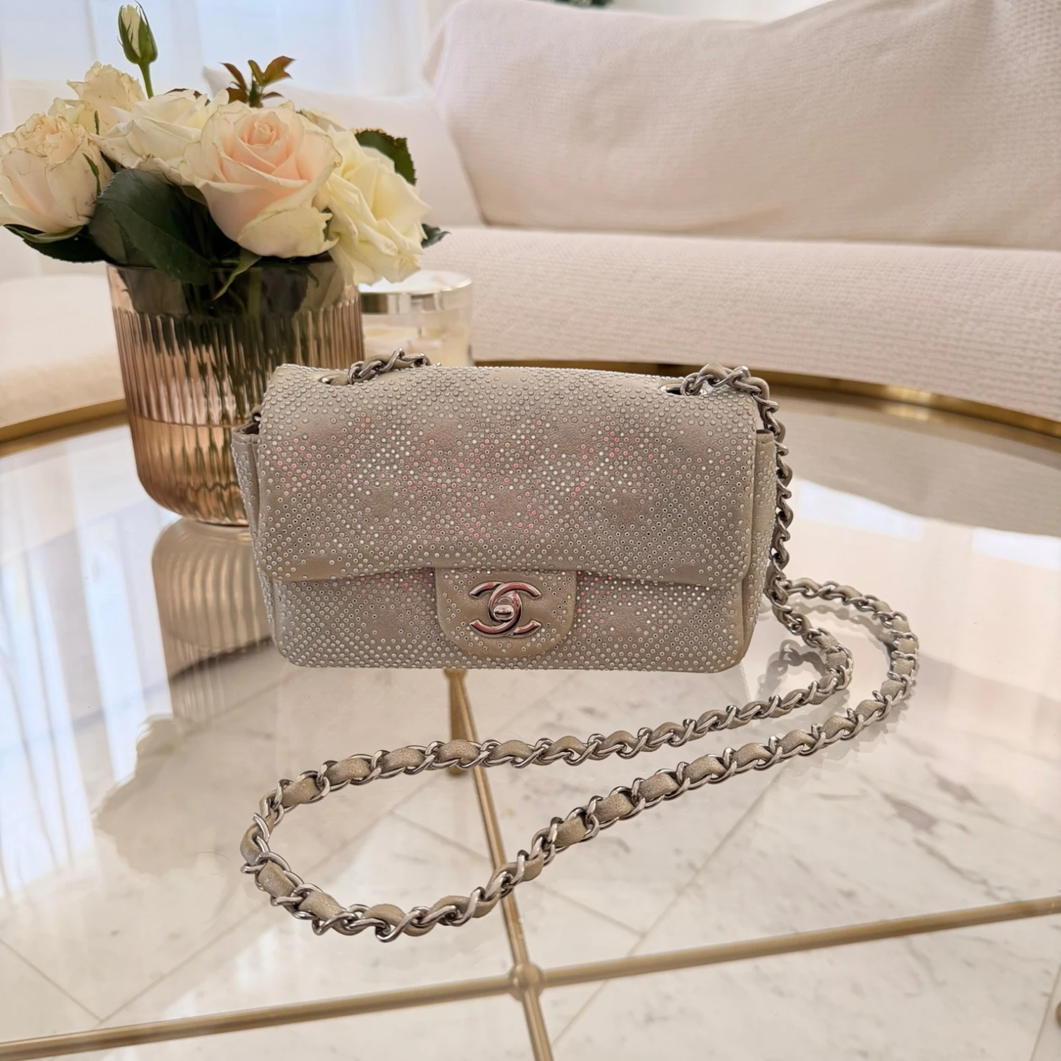 Chanel iridescent studded calfskin Mini Flap crossbody bag, with a chain strap and silver hardware available in Cyprus at HOUSE of MICY